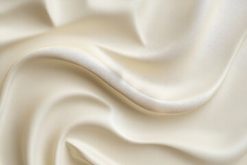 Fototapeta premium Creamy, flowing silk fabric texture close-up.