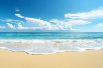 Fototapeta premium Sunny coastal scene with gentle waves and fluffy clouds.