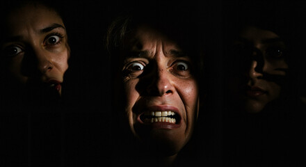 Women expressing fear in dark backgrounds  