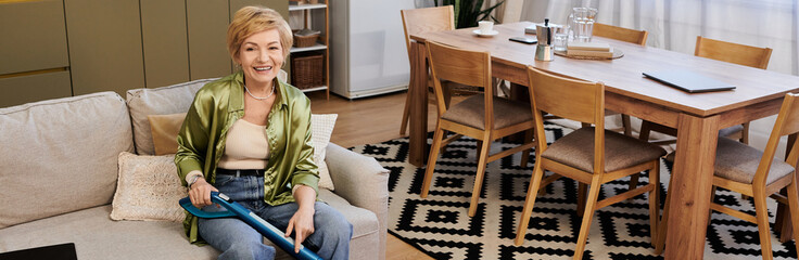 Senior woman enjoying a moment of relaxation in her cozy home while cleaning