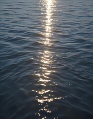 Sunlit water ripples, shimmering surface, tranquil scene,  texture,  beauty