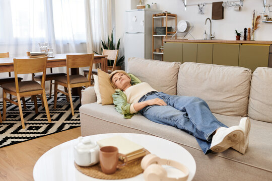Relaxing afternoon for a beautiful senior woman in her cozy living room filled with warmth