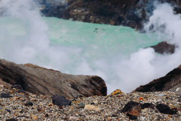 Mount Aso Nakadake volcano crater, Aso-San, caldera, Aso-Kuju National Park hiking, Kyushu island region, Kumamoto prefecture, Japan, eruption with steam and smoke, volcanic desert landscape view
