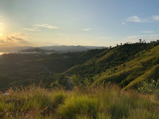Serene Sunset Panorama: Rolling Hills and Golden Hour