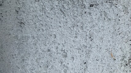 gravel surface that has been cemented and painted white