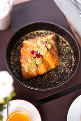 Delicious croissant served with unique toppings at a local cafe