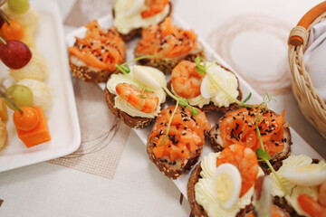 Assorted canapes for the festive table. Catering services for banquets. 
