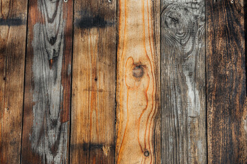 Wooden planks with rich textures in varied tones creates a rustic backdrop