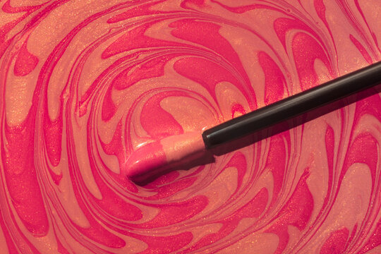 Coral blush orange and fuchsia pink berry cosmetic smudge glittering satin finish lip gloss swatches with applicator brush. 60s psychedelic style