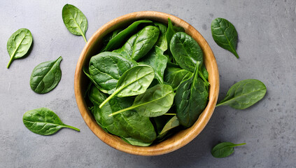 Obraz premium fresh spinach leaves on gray concrete background