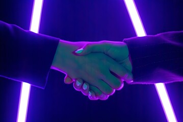 Hands of people shaking hands during a party, colorful neon lighting, social and festive atmosphere