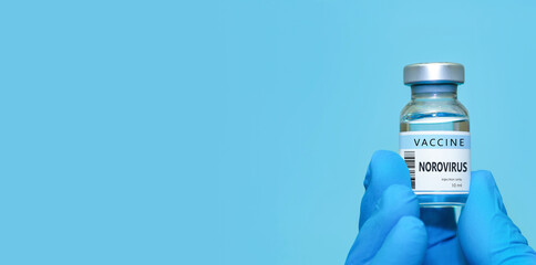 Doctor or nurse hand in medical gloves holds vaccine.Сopy space.The concept of medicine, healthcare and science