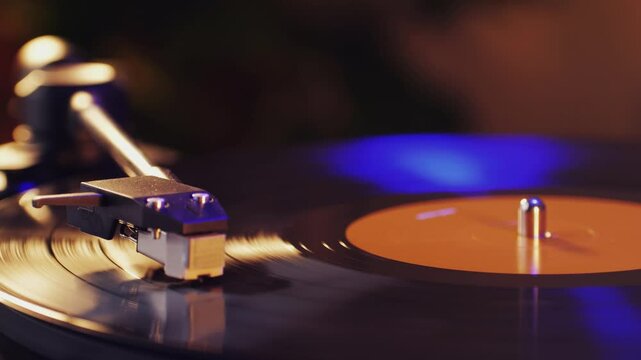 Grooving vinyl Needle glides through rotating record