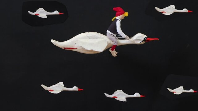 mother goose and boy Nils, white geese swans, stop motion