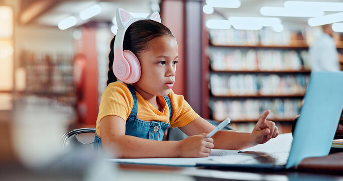 Student, child and laptop with headphones in library for elearning lesson, online teaching platform or video call. Distance learning, education or girl with technology for language class or knowledge