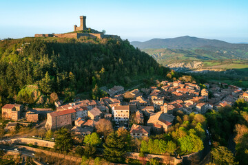 Rocca di Radicofani castle overlooking the Radicofani town in Val d'Orcia valley, Tuscany, Italy