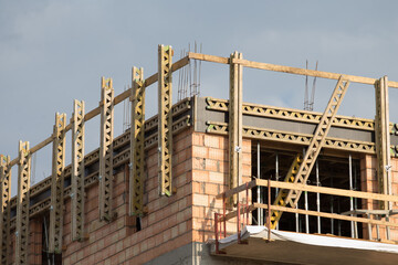 An active construction site featuring intricate building framework along with wellplaced scaffolding structures