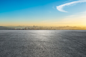 Asphalt road platform and city skyline with modern buildings at sunset in Shenzhen