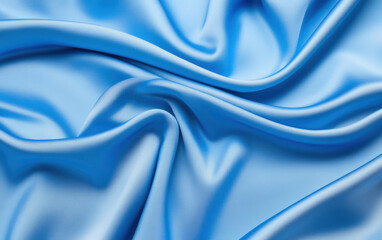 Soft blue satin fabric drapes elegantly, showcasing its smooth texture and sheen, perfect for various design projects