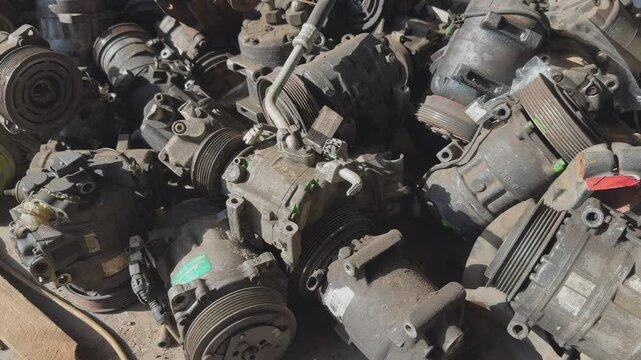 Warehouse of broken compressors for car air conditioner. Car air conditioner repair.