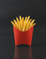 French Fries in Red Paper Container on Black Background
