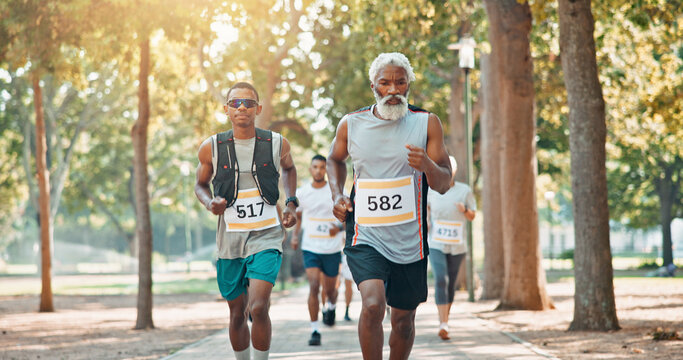 Running, marathon and training with people in park for charity event, health challenge and fitness. Race, fundraising competition and exercise with group of runners in nature for workout and sports