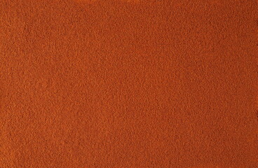 Spicy chili red pepper ground, milled dry paprika background and texture, top view