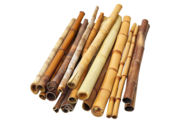 Bamboo sticks in various colors and sizes arranged artistically on a white background for crafting or decoration