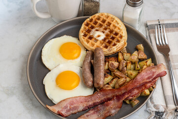 fried eggs with waffles  top with melted butter and  syrup