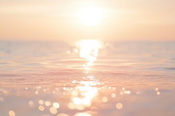 Bokeh sunlight reflects off of sea waves, warm light over ocean water background