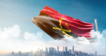 Angola national flag waving with skyline and buildings. A beautiful view of flag with skyline.