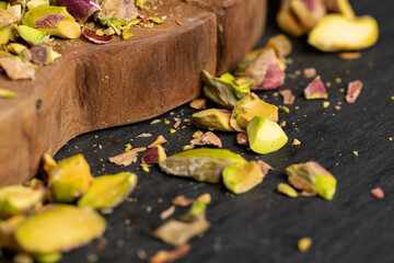 pistachios peeled from the shell, salted crunchy nuts, pistachios without shells, side view