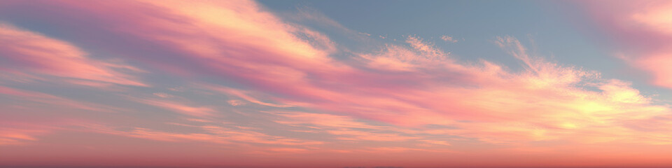 Soft pink clouds stretch across a peaceful sunset sky