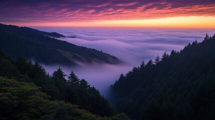 Beautiful mountain view above a sea of colorful fog at dusk