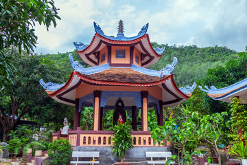 beautiful pagoda on the lake shore during sunset in vietnam