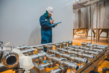 Male work inspection process stainless steel pipe stainless with pressure meter in equipment tank...
