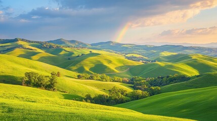 Bright Rainbow Stretching over Rolling Green Hills