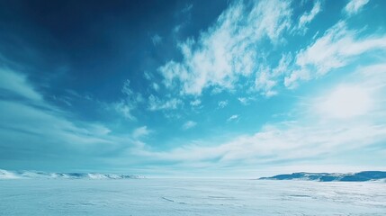 Fototapeta premium Frozen Arctic Tundra Stretching under Blue Sky