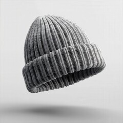 Floating grey knit beanie on neutral background – winter fashion accessory in minimal style