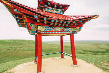 The gazebo in Elista, decorated with intricate patterns and surrounded by lush greenery, serves as...