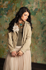 Fototapeta premium Brunette female model posing indoor, fashion beauty portrait