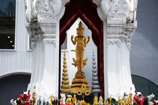 Ancient trimurti god statue or lord supreme trinity figure in shrine for thai people traveler travel visit and respect praying blessing holy on patio of central world at Pathumwan in Bangkok, Thailand