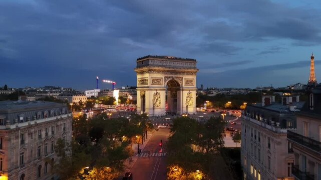 Drone night view of Arc de Triomphe (Arch of Triumph) in Paris, France