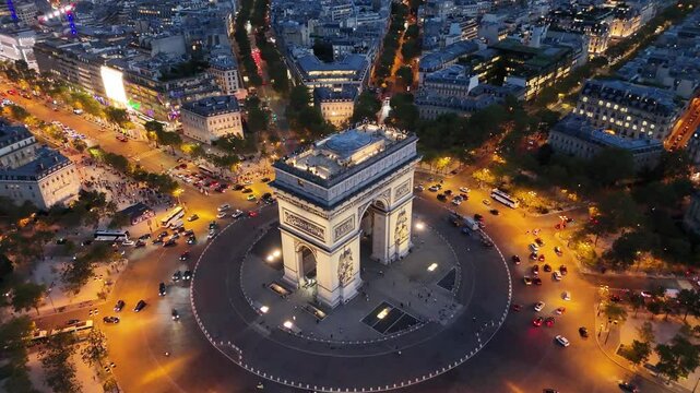 Night aerial shot of Arc de Triomphe (Arch of Triumph) in Paris, France