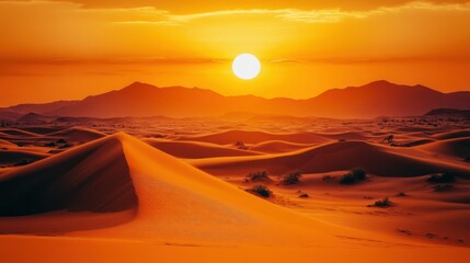 A beautiful desert landscape features sand dunes under a setting sun