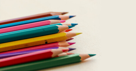 Colorful pencils on white background.
