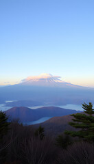 Mountain Fuji with cloud and Kawaguchiko lake in early morning seen from Shindo toge view point, photo. White tone