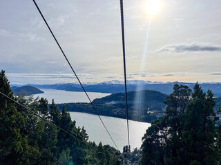 Beautiful range of snowy mountains and a lake with blue sky above in Bariloche Argentina, amazing panoramic view at Circuito Chico Patagonia.