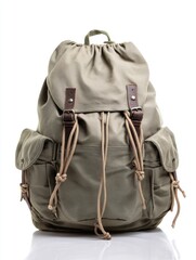 Naklejka premium Military style canvas backpack features multiple pockets and drawstring closure for utility and durability in outdoor activities