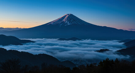 Fototapeta premium Majestic Mount Fuji at Sunrise Above a Sea of Clouds – Iconic Japanese Landscape with Silhouetted Trees
